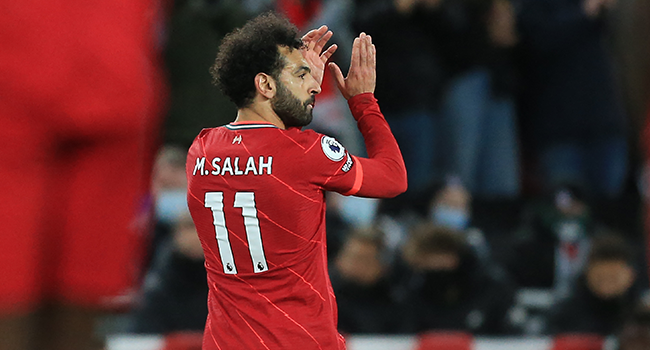Liverpool's Egyptian midfielder Mohamed Salah applauds supporters as he leaves the game, substituted during the English Premier League football match between Liverpool and West Ham United at Anfield in Liverpool, north west England on March 5, 2022. Lindsey Parnaby / AFP