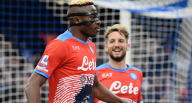 Napoli's Nigerian forward Victor Osimhen (L) celebrates after scoring his second goal during the Italian Serie A football match between Napoli and Udinese on March 19, 2022 at the Diego-Maradona stadium in Naples. Filippo MONTEFORTE / AFP