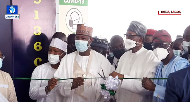 President Muhammadu Buhari (2nd right) commissioned a new airport terminal in Lagos on March 22, 2022.