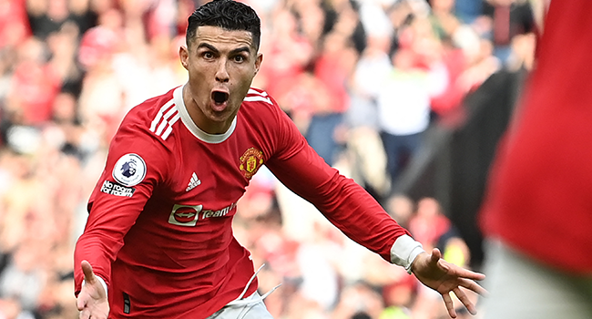 Manchester United's Portuguese striker Cristiano Ronaldo celebrates after scoring his third goal during the English Premier League football match between Manchester United and Norwich City at Old Trafford in Manchester, north west England, on April 16, 2022. Paul ELLIS / AFP