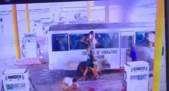 This screengrab from a viral video on social media shows NYSC members trying to escape a Coaster Bus after it caught fire.