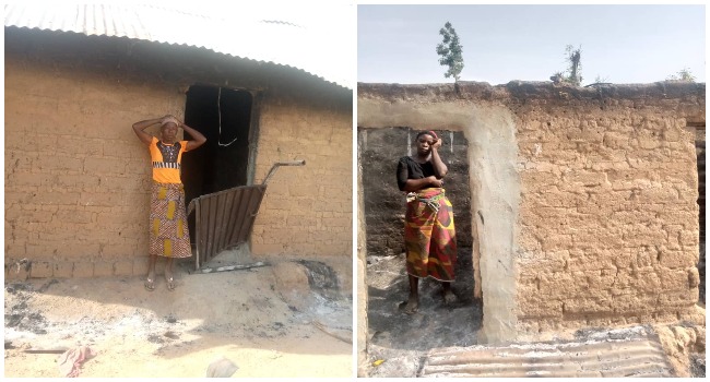 Women stand in front of their damaged houses after a bandits attack in Adei Village of Kutura Station, Kaduna State.