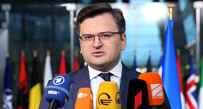 Ukraine's Foreign Minister Dmytro Kuleba speaks to the press with NATO Secretary General as they arrive for a meeting of NATO foreign ministers at NATO headquarters, in Brussels, on April 7, 2022. François WALSCHAERTS / AFP