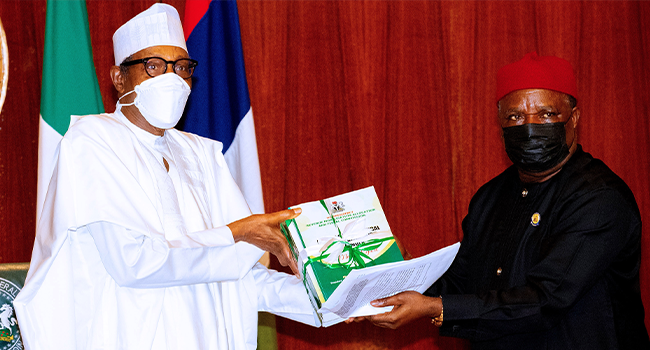 President Muhammadu Buhari receives the new revenue formula from the Chairman of the Revenue Mobilization Allocation and Fiscal Commission, Engr Elisa Mbam at the State House on April 7, 2022. Sunday Aghaeze/State House