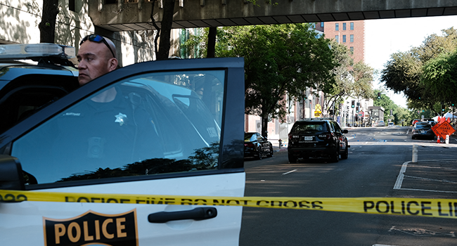 Police officers work the scene on the corner of 10th and L street of a shooting that occurred in the early morning hours on April 3, 2022 in Sacramento, California. David Odisho/Getty Images/AFP