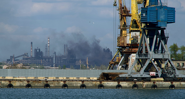 Smoke rises above the Azovstal steel plant in the city of Mariupol on April 29, 2022, amid the ongoing Russian military action in Ukraine. Andrey BORODULIN / AFP