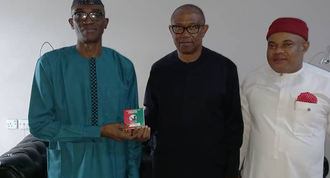 This photo, released by Peter Obi on May 27, 2022, shows him receiving the Labour Party membership card.