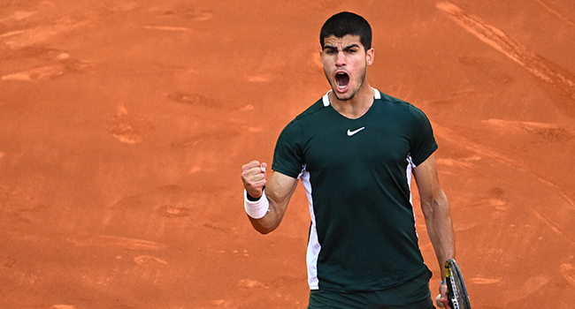 Spain's Carlos Alcaraz reacts as he plays against Serbia's Novak Djokovic during their 2022 ATP Tour Madrid Open tennis tournament men's singles semi-final match at the Caja Magica in Madrid on May 7, 2022. GABRIEL BOUYS / AFP