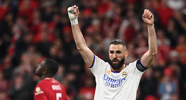 Real Madrid's French striker Karim Benzema celebrates his team's victory of the UEFA Champions League final football match between Liverpool and Real Madrid at the Stade de France in Saint-Denis, north of Paris, on May 28, 2022. Anne-Christine POUJOULAT / AFP
