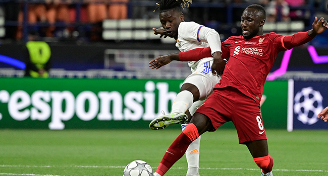 Liverpool's Guinean midfielder Naby Keita (R) and Real Madrid's French midfielder Eduardo Camavinga vie for the ball during the UEFA Champions League final football match between Liverpool and Real Madrid at the Stade de France in Saint-Denis, north of Paris, on May 28, 2022. JAVIER SORIANO / AFP