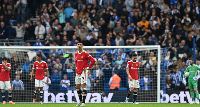 Manchester United's Portuguese striker Cristiano Ronaldo (C) and teammates react as another goal goes in for Brighton during the English Premier League football match between Brighton and Hove Albion and Manchester United at the American Express Community Stadium in Brighton, southern England on May 7, 2022. Glyn KIRK / AFP