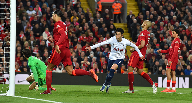 Tottenham Hotspur's South Korean striker Son Heung-Min (C) celebrates after scoring the opening goal of the English Premier League football match between Liverpool and Tottenham Hotspur at Anfield in Liverpool, north west England on May 7, 2022. Paul ELLIS / AFP