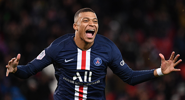 In this file photograph taken on February 29, 2020, Paris Saint-Germain's French forward Kylian Mbappe celebrates after scoring a goal during the French L1 football match between Paris Saint-Germain (PSG) and Dijon at the Parc des Princes stadium in Paris. FRANCK FIFE / AFP