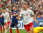 Denmark's forward Andreas Cornelius celebrates after scoring his team's first goal during the UEFA Nations League - League A Group 1 first leg football match between France and Denmark at the Stade de France in Saint-Denis, north of Paris, on June 3, 2022. Geoffroy VAN DER HASSELT / AFP