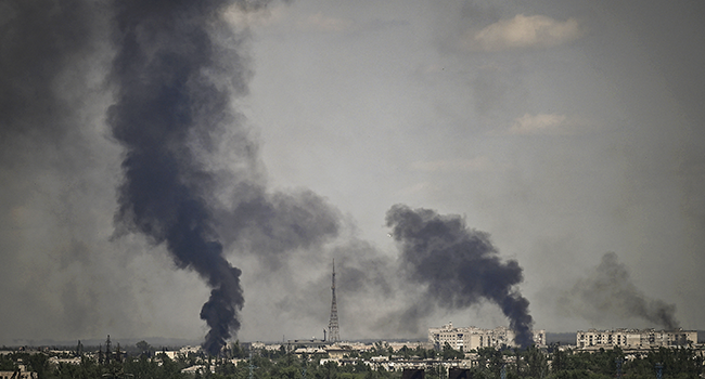 Smoke rises in the city of Severodonetsk during heavy fightings between Ukrainian and Russian troops at eastern Ukrainian region of Donbas on May 30, 2022, on the 96th day of the Russian invasion of Ukraine. ARIS MESSINIS / AFP