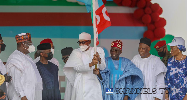 President Muhammadu Buhari and Bola Ahmed Tinubu hoist the APC flag at the Eagle Square in Abuja on June 8, 2022, after winning the latter won the party's presidential ticket for the 2023 elections. Sodiq Adelakun/Channels Television