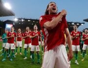 Hungary's striker Adam Szalai (C) leads the celebrations as Hungary's players celebrate in front of their supporters after the UEFA Nations League, league A group 3 football match between England and Hungary at Molineux Stadium in Wolverhampton, central England on June 14, 2022. Hungary won the game 4-0. Adrian DENNIS / AFP