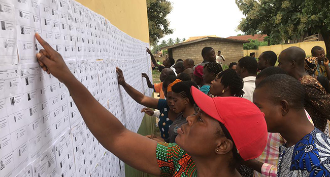 Voters check for their details in a polling unit in Ekiti state on June 18, 2022. Sodiq Adelakun/Channels Television