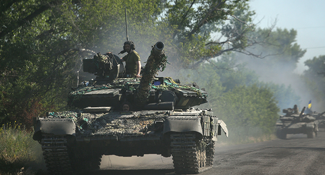 Ukrainian troop move by tanks on a road of the eastern Ukrainian region of Donbas on June 21, 2022, as Ukraine says Russian shelling has caused "catastrophic destruction" in the eastern industrial city of Lysychansk, which lies just across a river from Severodonetsk where Russian and Ukrainian troops have been locked in battle for weeks. Anatolii Stepanov / AFP