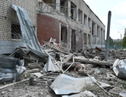 A photograph taken on June 28, 2022 shows the ruins of a school building, partially destroyed by two rockets in the Ukrainian city of Kharkiv. SERGEY BOBOK / AFP