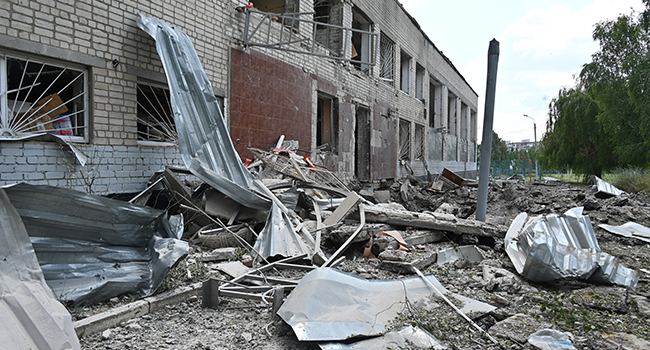 A photograph taken on June 28, 2022 shows the ruins of a school building, partially destroyed by two rockets in the Ukrainian city of Kharkiv. SERGEY BOBOK / AFP