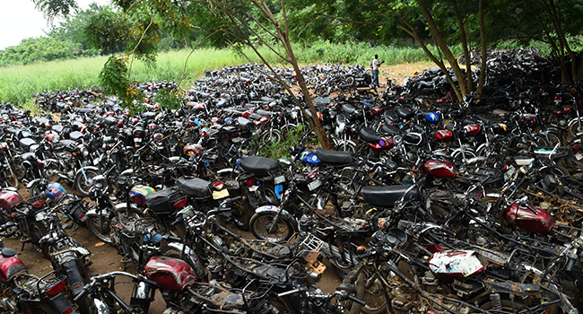 A general view of hundreds of taxi motorcycles, popularly called Okada, seized and waiting to be crushed by the Lagos Environmental Task Force following a ban on bike transport in Lagos on June 3, 2022. PIUS UTOMI EKPEI / AFP