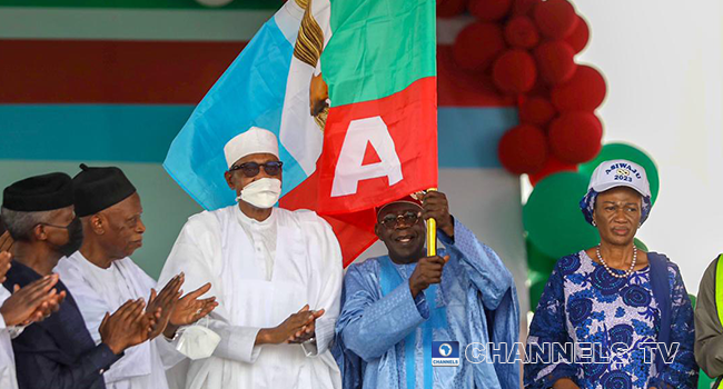 Bola Ahmed Tinubu hoists the APC flag at the Eagle Square in Abuja on June 8, 2022, after winning the party's presidential ticket for the 2023 elections. Sodiq Adelakun/Channels Television