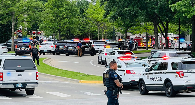 In this handout photo courtesy of Tulsa Police Department taken on June 1, 2022, Police officers respond to a call about a man armed with a rifle at the Natalie Building at St. Francis Hospital in Tulsa, Oklahoma. Tulsa Police Department / AFP