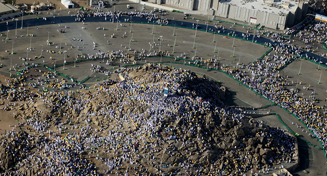 An aerial view shows Muslim pilgrims gathering atop Mount Arafat, also known as Jabal al-Rahma (Mount of Mercy), southeast of the holy city of Mecca, during the climax of the Hajj pilgrimage, on July 8, 2022. (Photo by AFP)