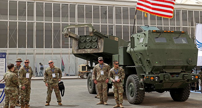 In this file photo taken on March 06, 2022 US military personnel stand by a M142 High Mobility Artillery Rocket System (HIMARS) during Saudi Arabia’s first World Defense Show, north of the capital Riyadh. Photo by Fayez Nureldine / AFP
