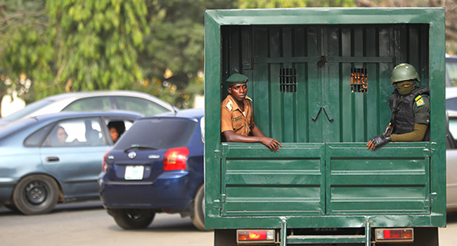 Men of the Nigeria Correction Service departs the Federal High Court in Abuja as they convey convicts to the Kuje Prison in Abuja. Photo: Sodiq Adelakun/Channels TV