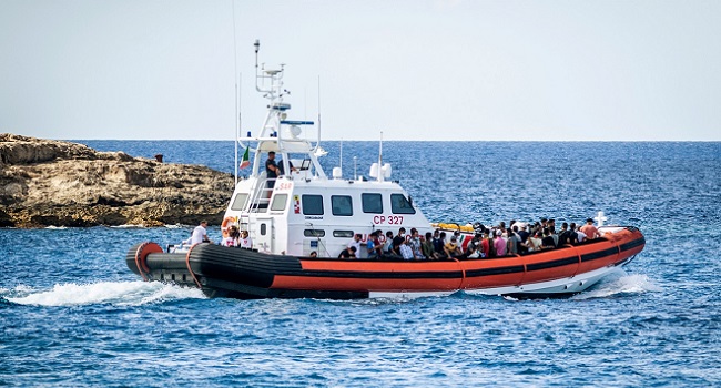 File photo: Migrants aboard a Guradia di Finanza and Navy military vessel are tranferred from the so-called migrant "Hotspot" operational processing facility on the southern Italian Island of Lampedusa, south of Sicily, to another center, on July 11, 2022. (Photo by Alessandro SERRANO / AFP)