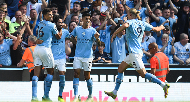 Manchester City's German midfielder Ilkay Gundogan (2nd L) celebrates after scoring his team first goal during the English Premier League football match between Manchester City and Bournemouth at the Etihad Stadium in Manchester, north west England, on August 13, 2022. (Photo by Oli SCARFF / AFP)