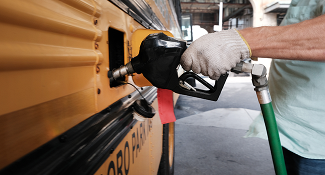 A bus driver fills up at a gas station in Brooklyn on August 11, 2022 in New York City. Spencer Platt/Getty Images/AFP