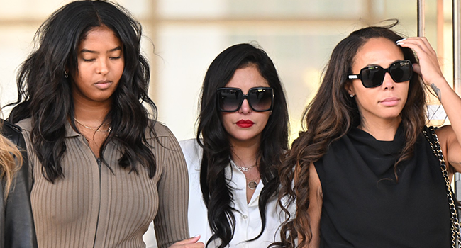 Vanessa Bryant (C), wife of the late Los Angeles Lakers basketball player Kobe Bryant, her daughter Natalia Bryant (L), and close friend Sydney Leroux (R) depart the court house in Los Angeles, California, on August 24, 2022, after a verdict was reached in Bryant's federal negligence lawsuit against Los Angeles County. (Photo by Patrick T. FALLON / AFP)