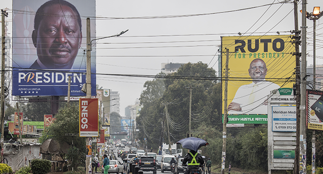 Posters for Azimio la Umoja (Quest for Unity) One Kenya coalition presidential candidate Raila Odinga (L) and United Democratic Alliance Party presidential candidate William Ruto (R) are seen in Nairobi, on August 04, 2022. (Photo by MARCO LONGARI / AFP)