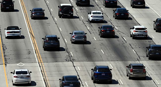 Cars, SUVs, and other vehicles drive in traffic on the 405 freeway through the Sepulveda Pass in Los Angeles, California, on August 25, 2022. Photo by Patrick T. FALLON / AFP