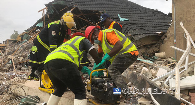 Rescue officials at work after a building collapsed in Abuja on August 26, 2022. Sodiq Adelakun/Channels Television