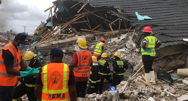 Rescue officials at work after a building collapsed in Abuja on August 26, 2022. Sodiq Adelakun/Channels Television