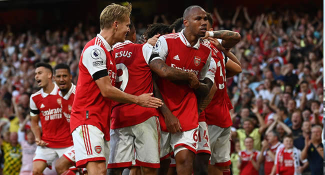 Arsenal's Brazilian defender Gabriel Magalhaes (2R) celebrates scoring during the English Premier League football match between Arsenal and Fulham at the Emirates Stadium in London on August 27, 2022. (Photo by Glyn KIRK / AFP)