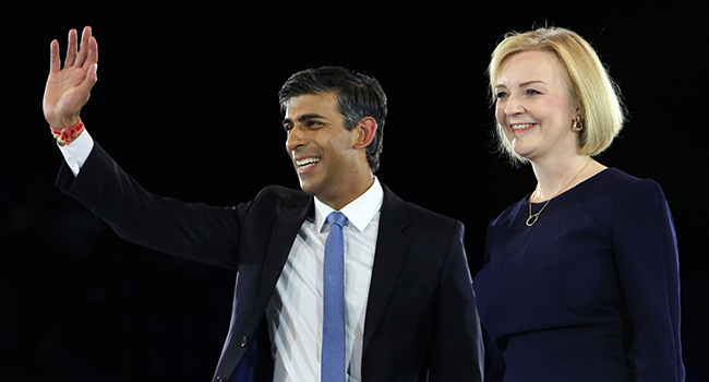 In this file photo taken on August 31, 2022 Rishi Sunak, Britain's former Chancellor of the Exchequerm (L) and Britain's Foreign Secretary Liz Truss, the final two contenders to become the country's next Prime Minister and leader of the Conservative party, stand together on stage during the final Conservative Party Hustings event at Wembley Arena, in London. (Photo by Susannah Ireland / AFP)