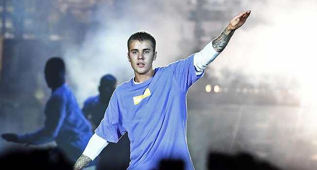 In this file photo taken on September 20, 2016 shows Canadian singer Justin Bieber performing on stage at the AccorHotels Arena in Paris. (Photo by CHRISTOPHE ARCHAMBAULT / AFP)