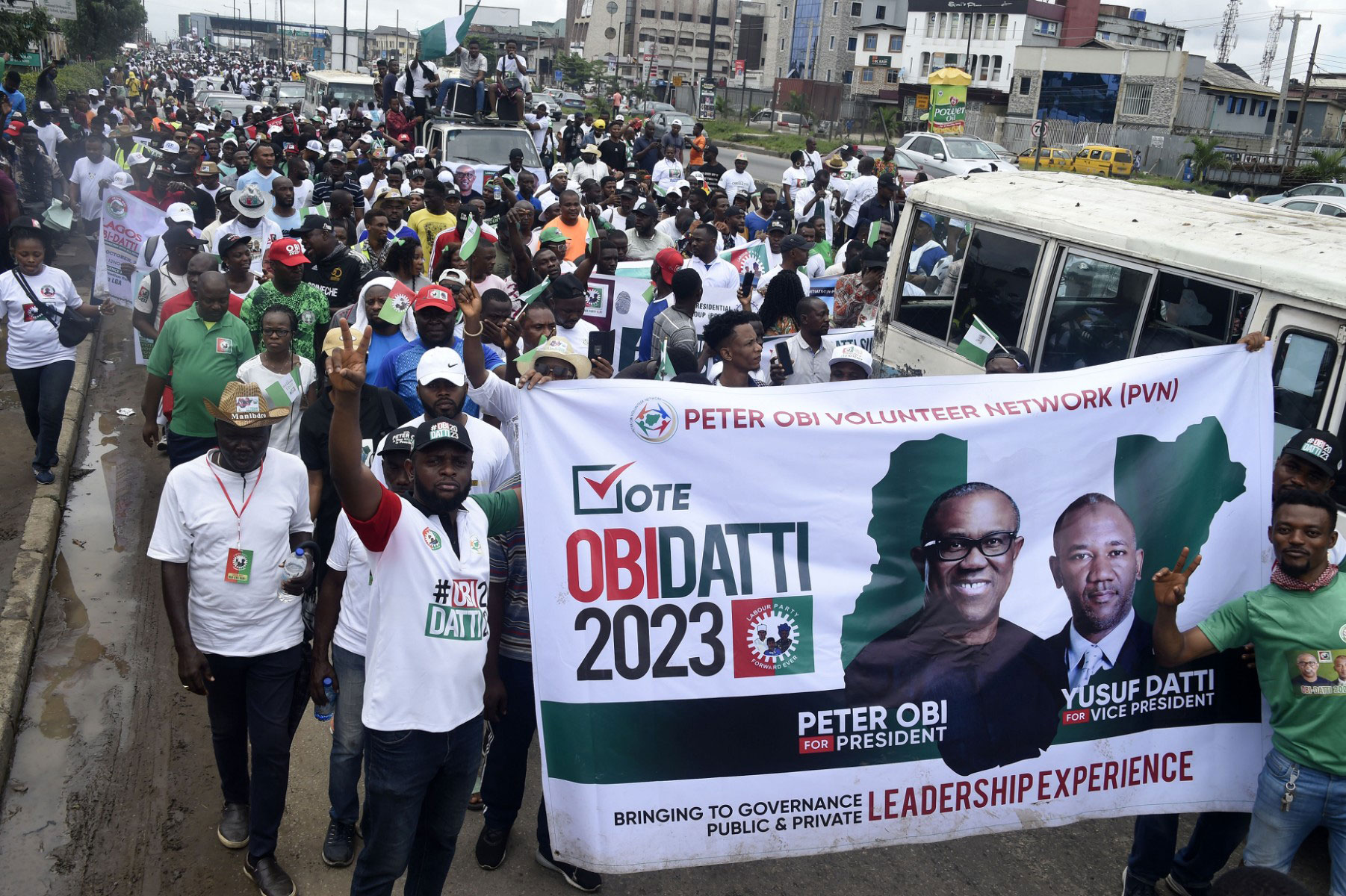 Supporters of presidential candidate of the Labour Party Peter Obi and running mate Datti Baba-Ahmed march during a campaign rally in Lagos, on October 1, 2022. (Photo by PIUS UTOMI EKPEI / AFP)