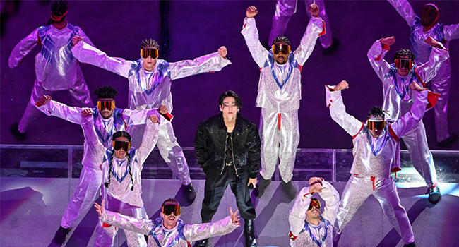 South Korean singer Jung Kook performs during the opening ceremony ahead of the Qatar 2022 World Cup Group A football match between Qatar and Ecuador at the Al-Bayt Stadium in Al Khor, north of Doha on November 20, 2022. (Photo by Kirill KUDRYAVTSEV / AFP)