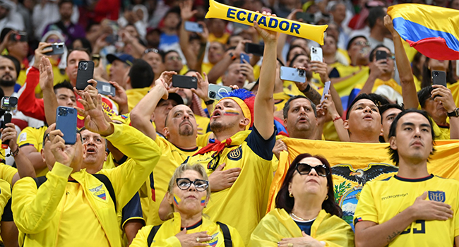 Ecuador supporters cheer ahead of the Qatar 2022 World Cup Group A football match between Qatar and Ecuador at the Al-Bayt Stadium in Al Khor, north of Doha on November 20, 2022. (Photo by Glyn KIRK / AFP)