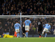 Manchester City's Norwegian striker Erling Haaland (2R) scores the team's second goal from the penalty spot during the English Premier League football match between Manchester City and Fulham at the Etihad Stadium in Manchester, north west England, on November 5, 2022. (Photo by ADRIAN DENNIS / AFP)