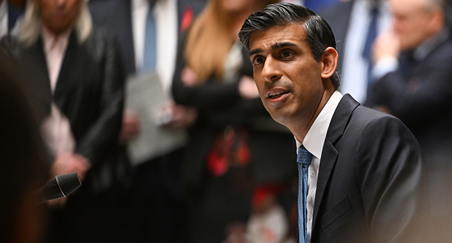 A handout photograph released by the UK Parliament shows Britain's Prime Minister Rishi Sunak speaking at the Despatch box during Prime Minister's Questions (PMQs) in the House of Commons in London on November 23, 2022. (Photo by JESSICA TAYLOR / UK PARLIAMENT / AFP)