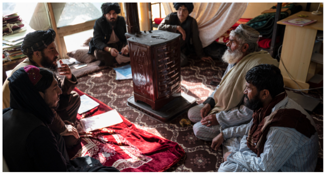 In this photo taken on November 28, 2022, head of the penal court Mohammad Mobin (2nd L) listens to a man (2nd R), who has been sentenced to death for murder, during a hearing at the Ghazni Court of Appeal in Ghazni, eastern Afghanistan. (Photo by Wakil KOHSAR / AFP)