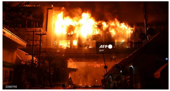 A major fire burns through the Grand Diamond City hotel-casino in Poipet on December 29, 2022. (Photo by AFP)