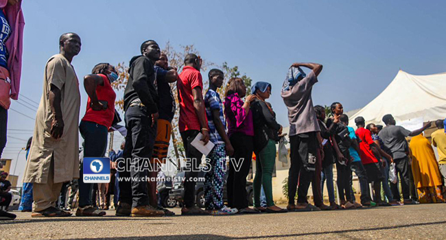 PHOTOS: Large Turnout As Abuja Residents Collect PVCs